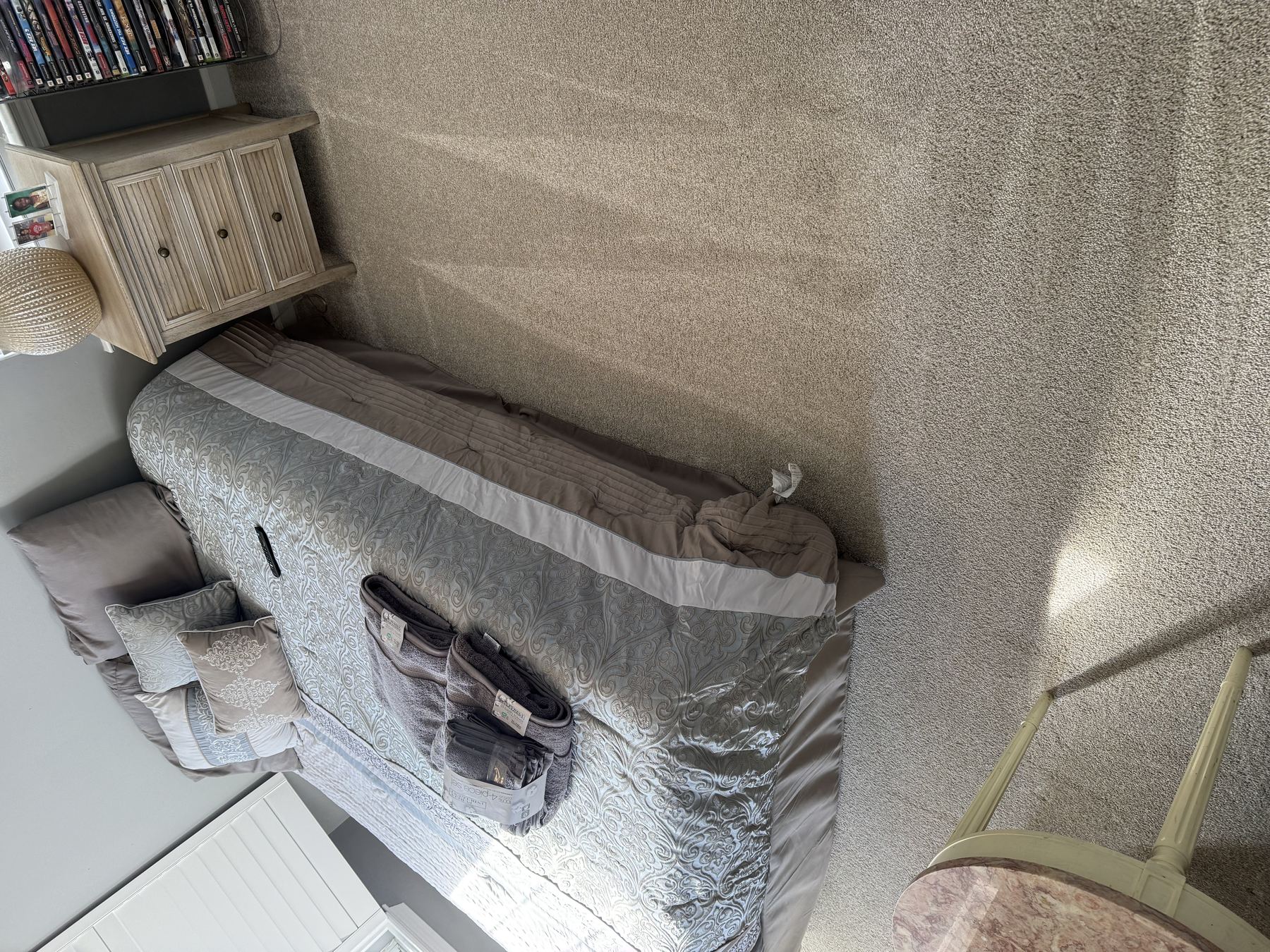 Staged bedroom, turnover clean, folded towels